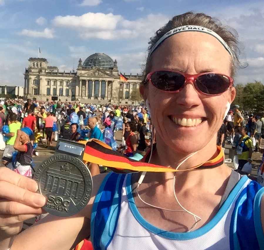 Denise Fay with Berlin Marathon medal at the Reichstag
