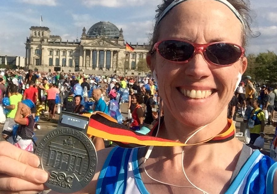 Denise Fay with Berlin Marathon medal at the Reichstag
